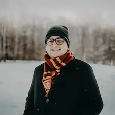 Tomo in winter, wearing Gryffindor scarf